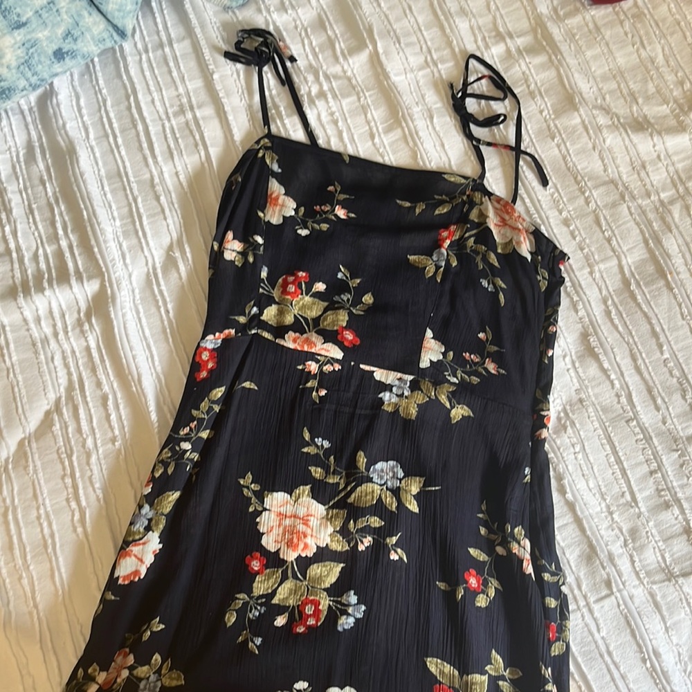 A medium sized, see through, dark blue coloured dress.